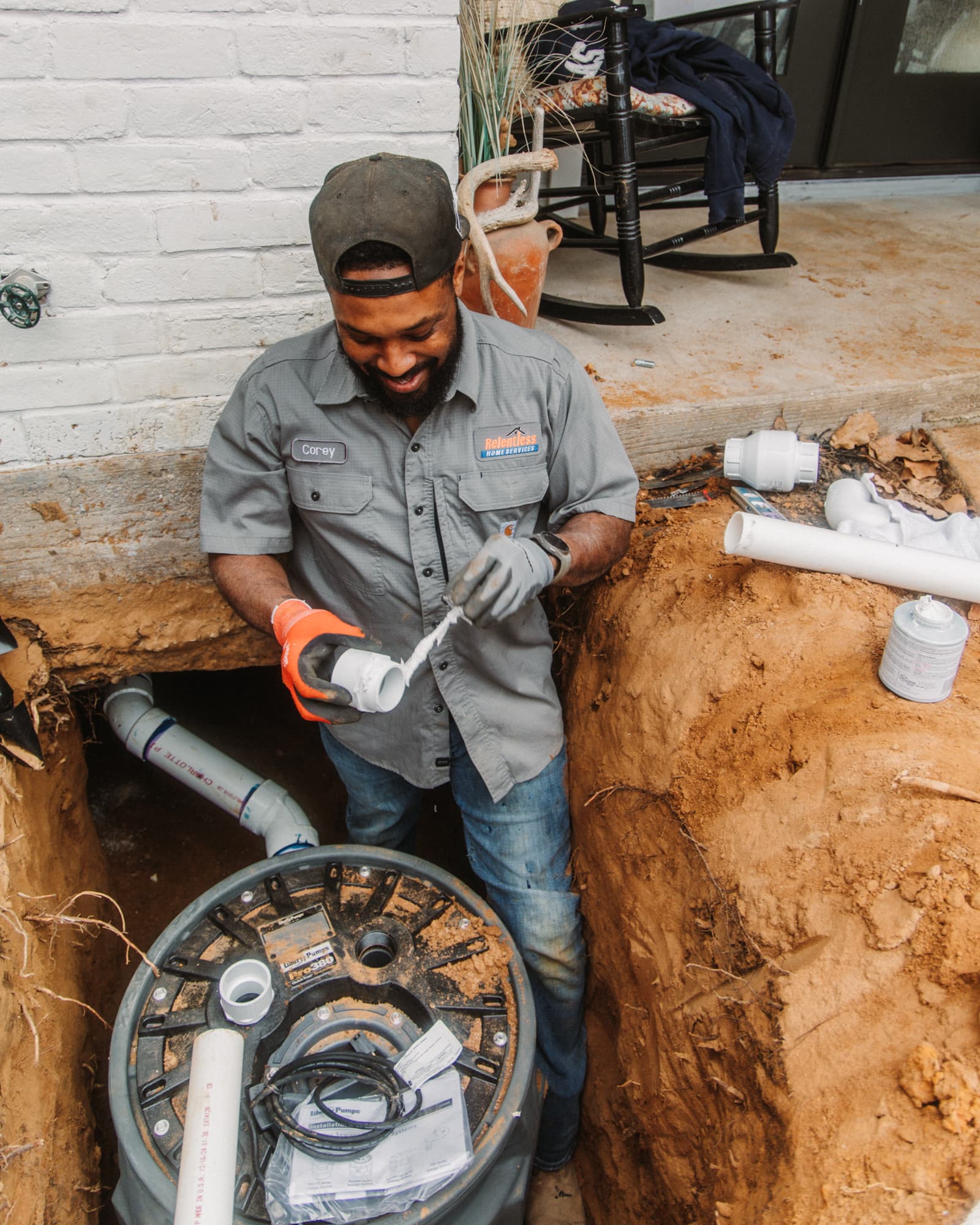 Relentless Plumbing Solutions technician installing sewer line